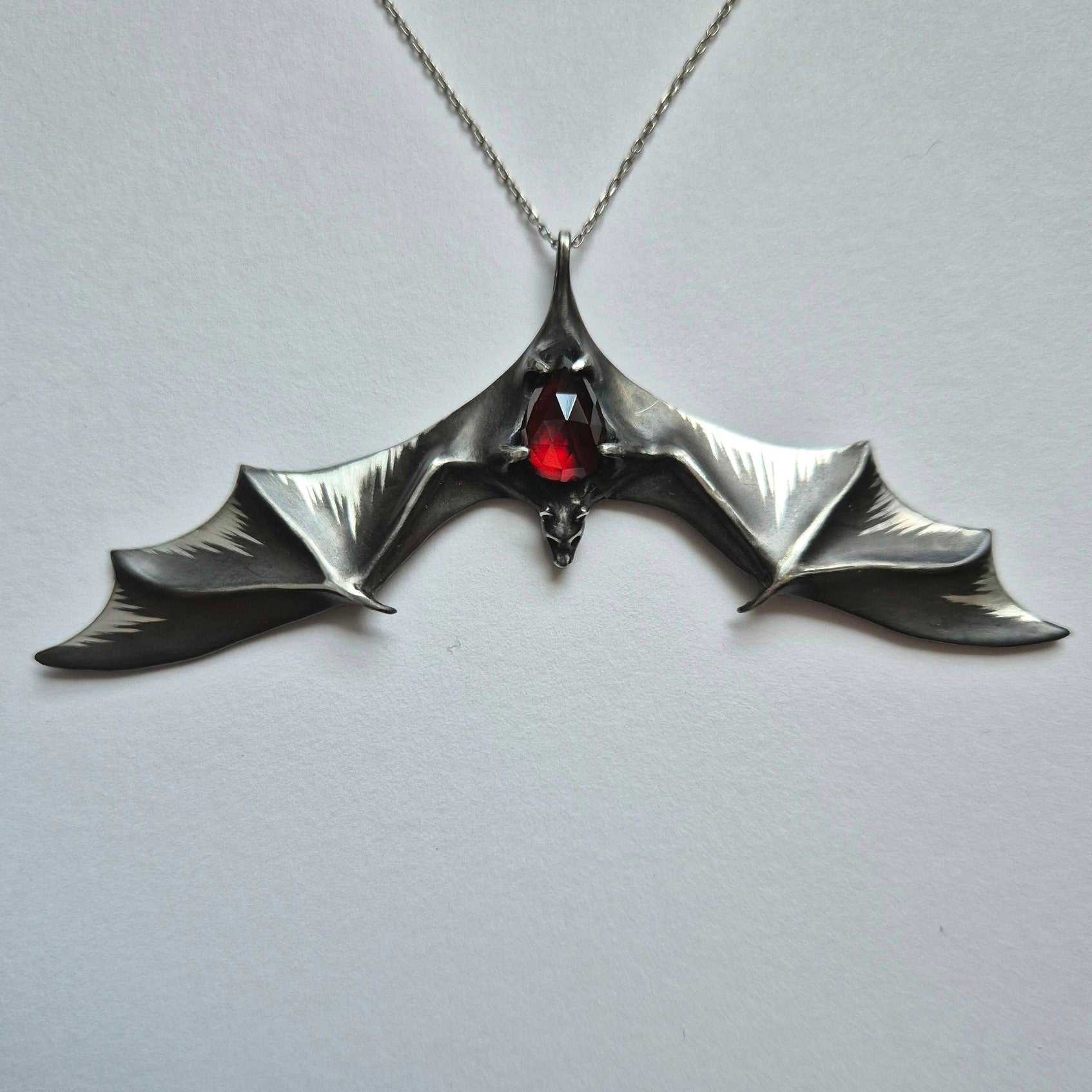 front view of Silver Bat necklace - Natural Garnet - Handmade symbolic jewelry
