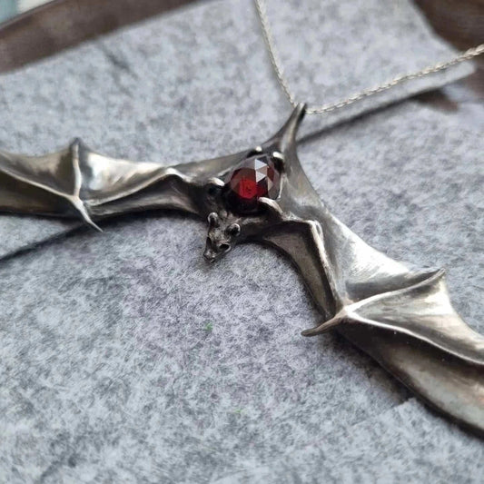 Close0up of Silver Bat necklace - Natural Garnet - Handmade symbolic jewelry