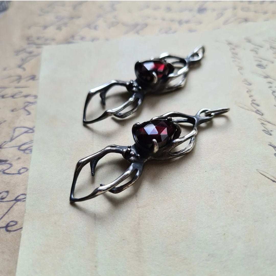 Set of silver spider necklaces with different garnet stone cuts – artisan silver jewelry collection