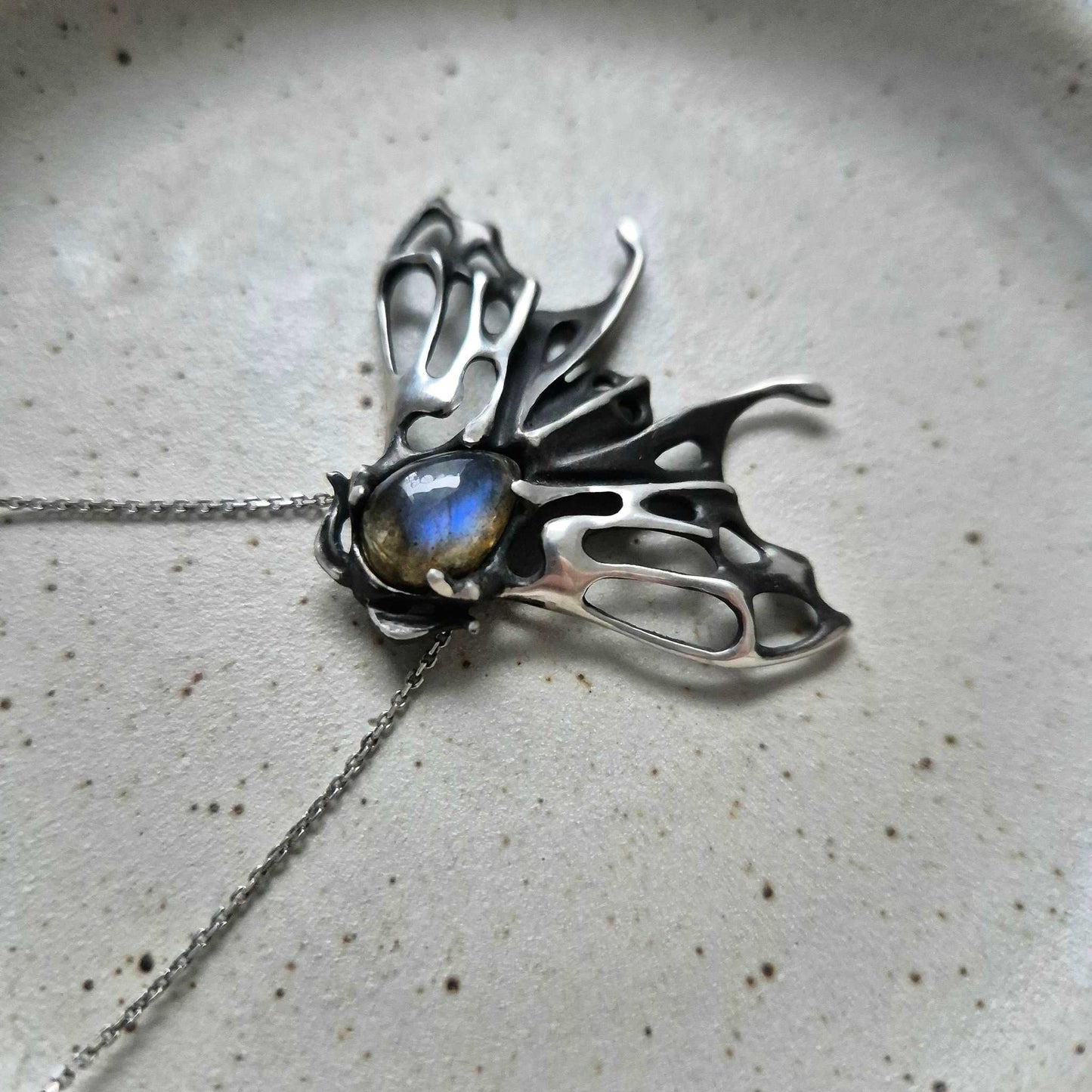 Delicate Moth-shaped silver necklace with blue labradorite gemstone centerpiece