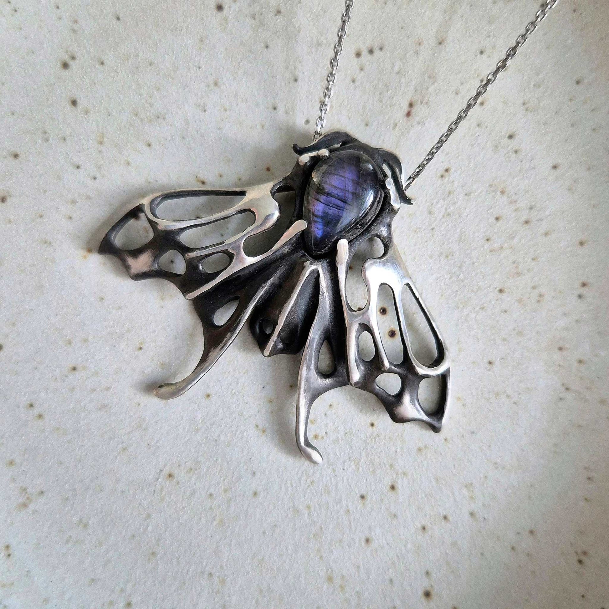 Delicate Moth necklace with shimmering purple labradorite