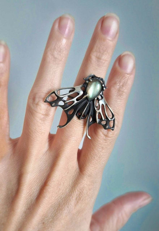 Silver Moth ring with silvery labradorite gemstone worn on hand, nature-inspired statement jewelry