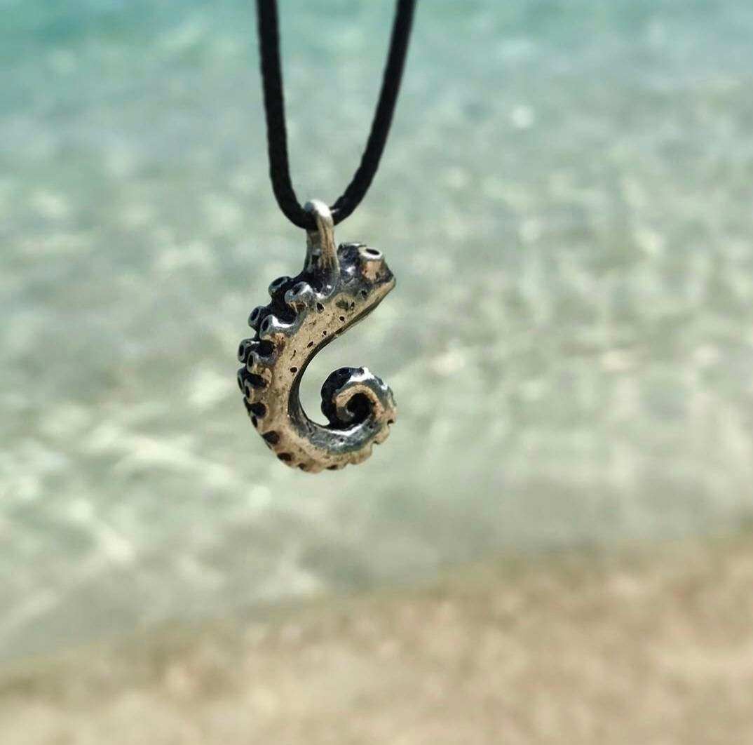 Tentacle necklace with turquoise sea in the background.