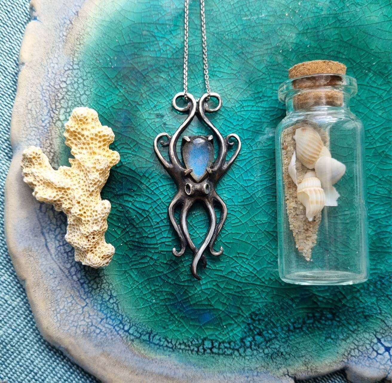 Silver Octopus necklace with ocean-inspired styling, blue labradorite gemstone and marine elements.