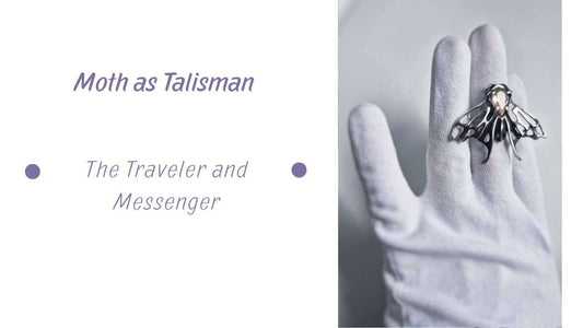 Moth Symbolism: a Moth ring in sterling silver, with a faceted sunstone, on a gloved hand