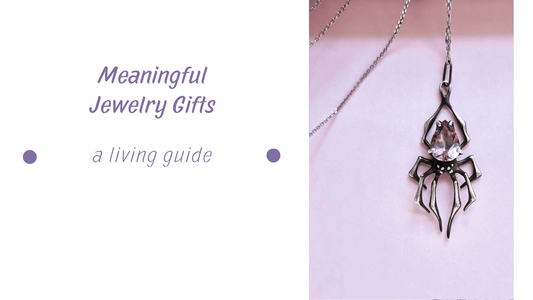 Meaningful gift - A silver Spider pendant with transparent pink amethyst on pink background