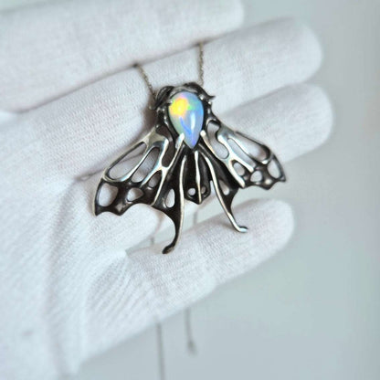 Opal Moth pendant with a natural Ethiopian opal gem, silver talisman