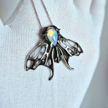 Opal Moth pendant with a natural Ethiopian opal gem, silver talisman