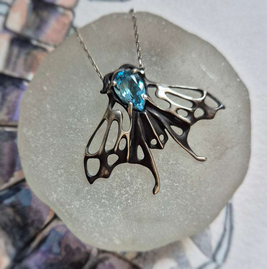 Azure Moth pendant with a faceted Swiss blue topaz gem, silver talisman