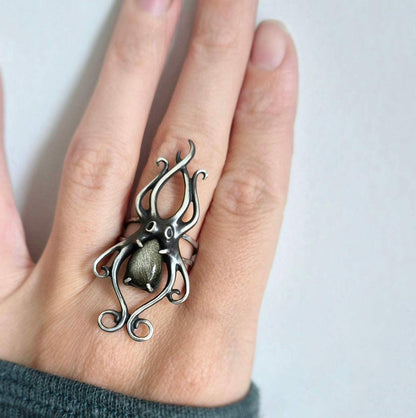 Golden Obsidian Octopus ring with a faceted labradorite gem, sea witch silver ring