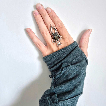 Golden Obsidian Octopus ring with a faceted labradorite gem, sea witch silver ring