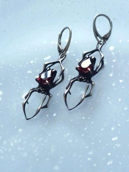 spider earrings in sterling silver - garnets