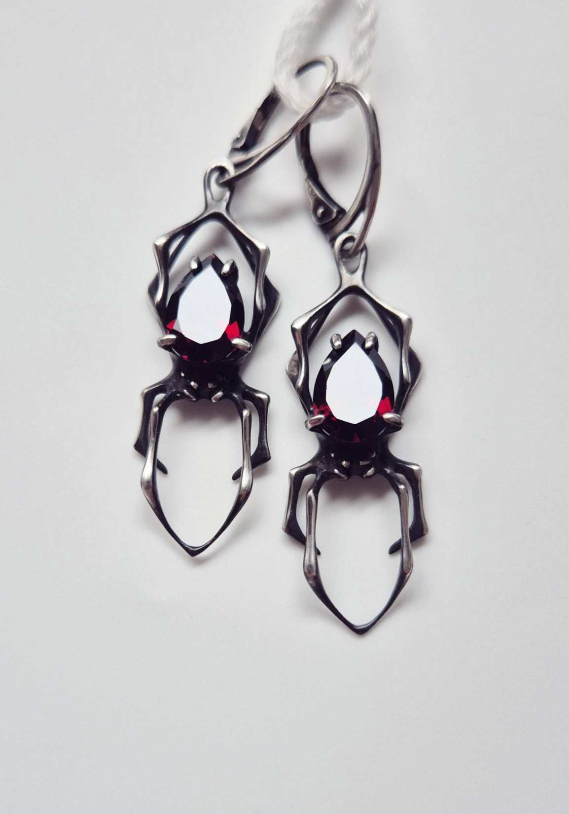 spider earrings in sterling silver - garnets
