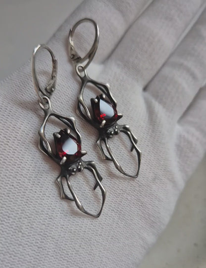 Dragonblood Spider earrings with faceted garnets, handmade Witchy silver jewelry