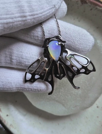 Opal Moth pendant with a natural Ethiopian opal gem, silver talisman