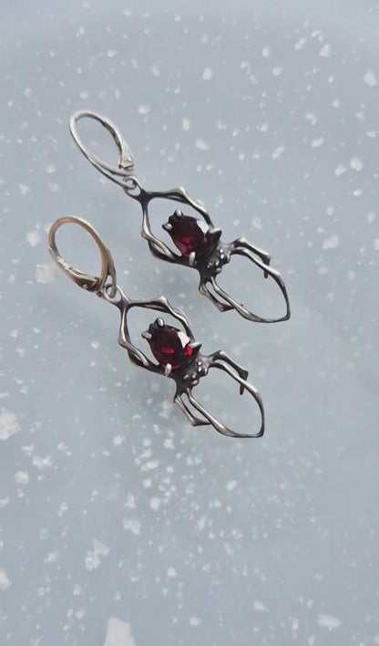 Dragonblood Spider earrings with faceted garnets, handmade Witchy silver jewelry