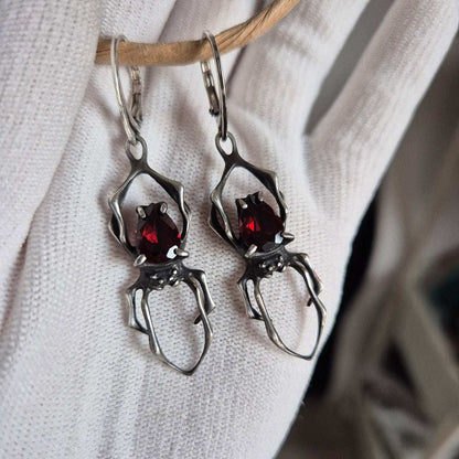 Dragonblood Spider earrings with faceted garnets, handmade Witchy silver jewelry