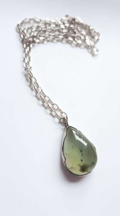Prehnite gemstone necklace arranged with chain in soft spiral