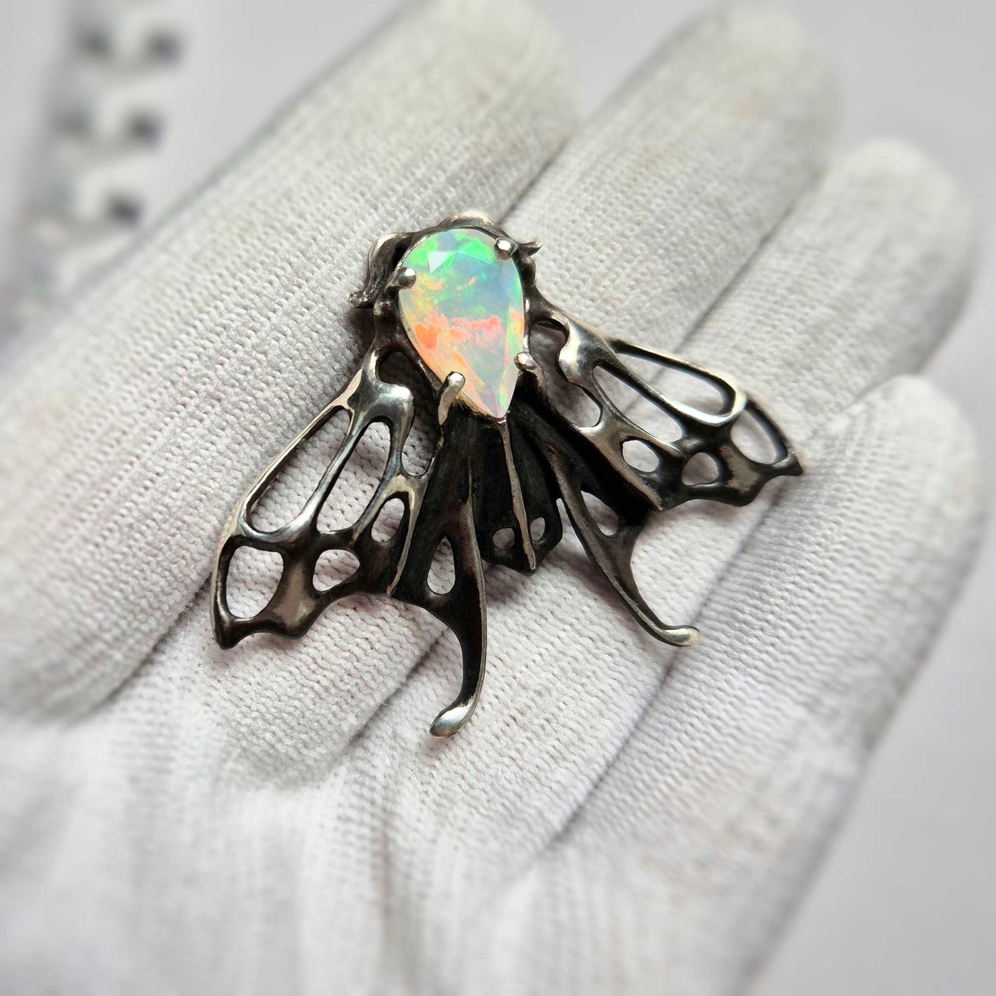 Opal Moth pendant with a natural Ethiopian opal gem, silver talisman