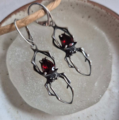 Dragonblood Spider earrings with faceted garnets, handmade Witchy silver jewelry