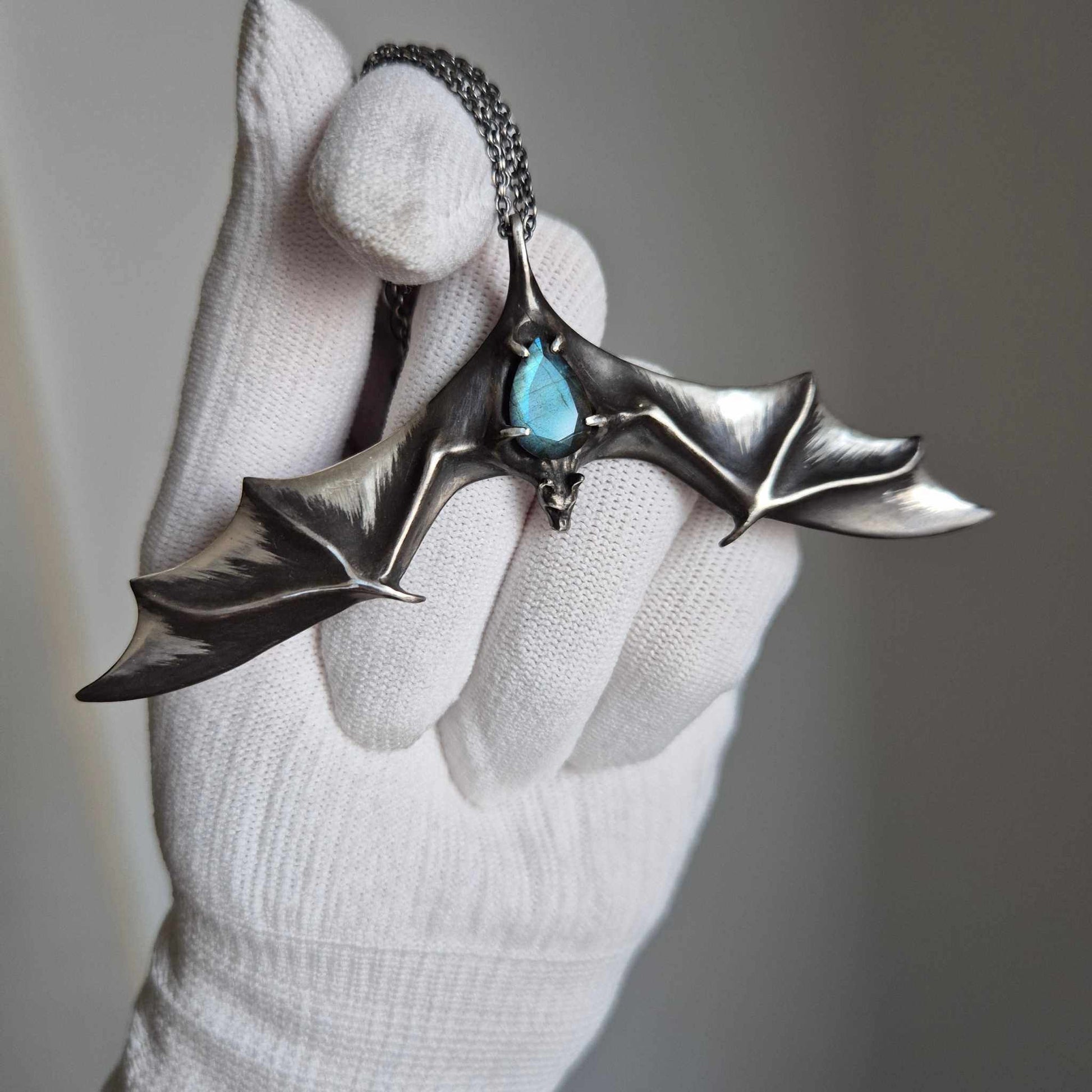 Aurora Bat pendant with a faceted blue labradorite gem, handmade Witchy - Vampire cosplay talisman in hand