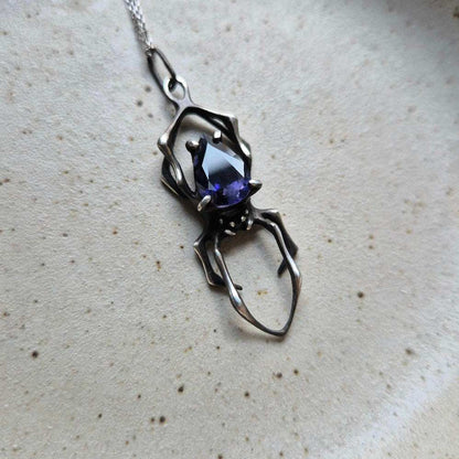 Night sky spider pendant with an iolite sunstone gem, Witchy silver talisman