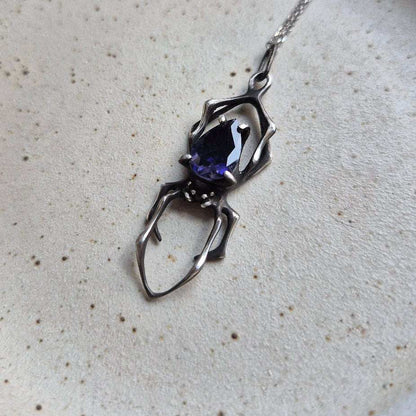 Night sky spider pendant with an iolite sunstone gem, Witchy silver talisman