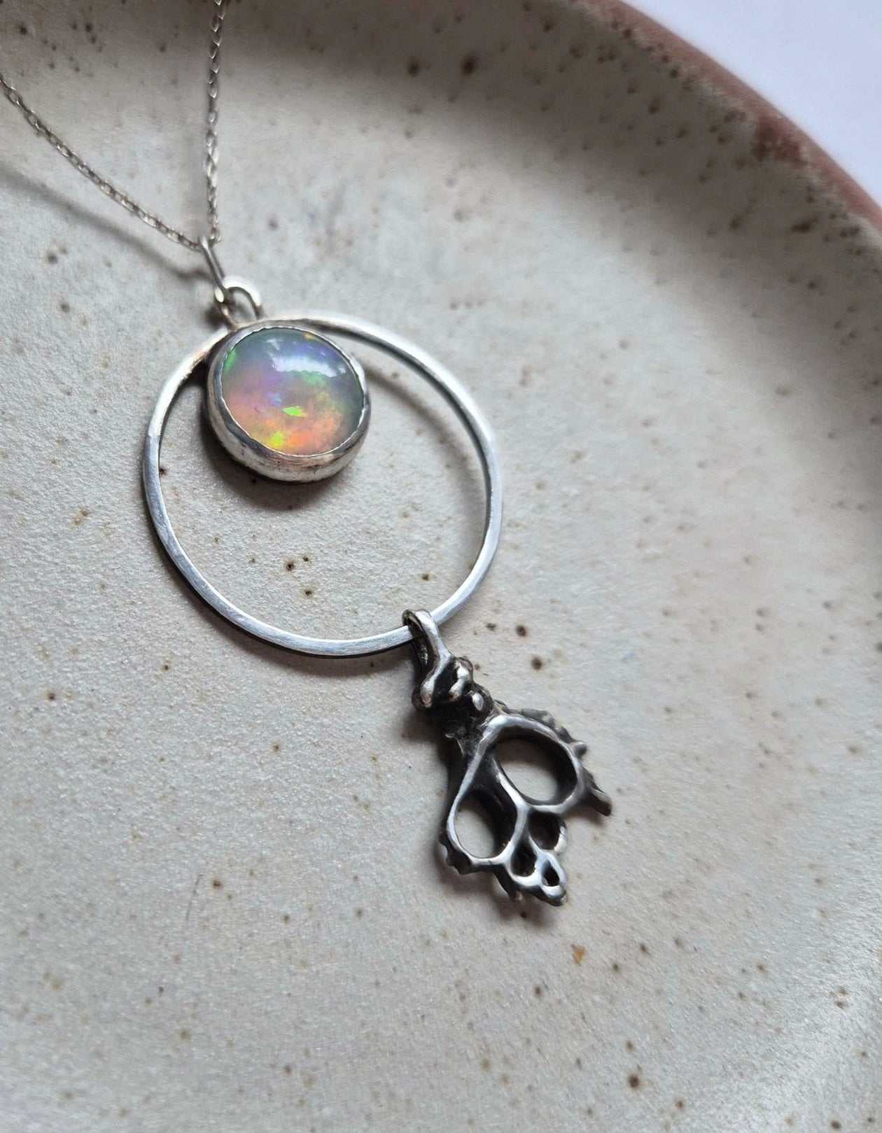 The Opal Serpent necklace with an opal cabochon. Silver talisman