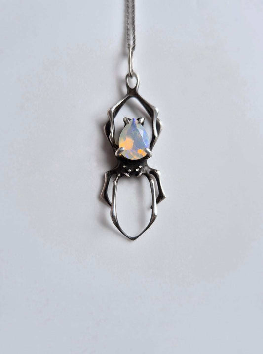 Spider necklace in Sterling silver with natural Opal gem on white background