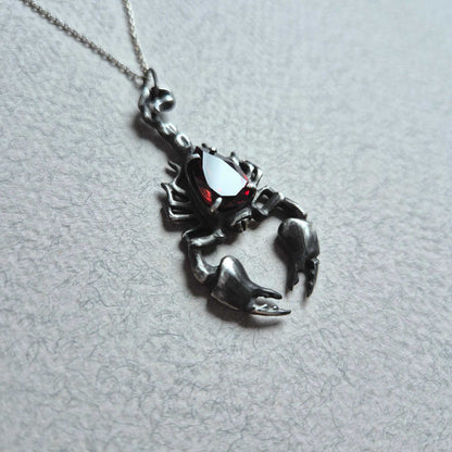 Dragonblood Scorpion pendant with a faceted garnet, handmade witchy talisman