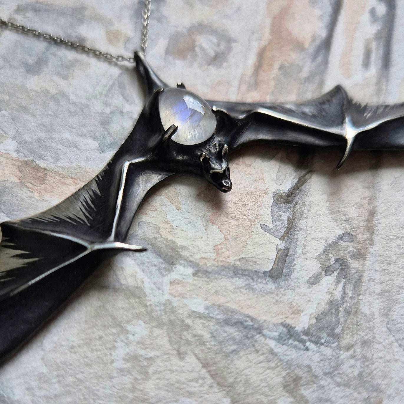 Lunar Bat pendant with a rainbow moonstone cabochon gem, handmade Witchy silver talisman